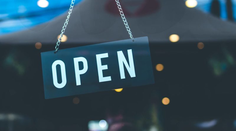 selective focus photography of open signage