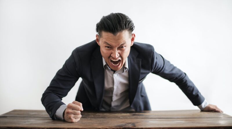 mad formal executive man yelling at camera