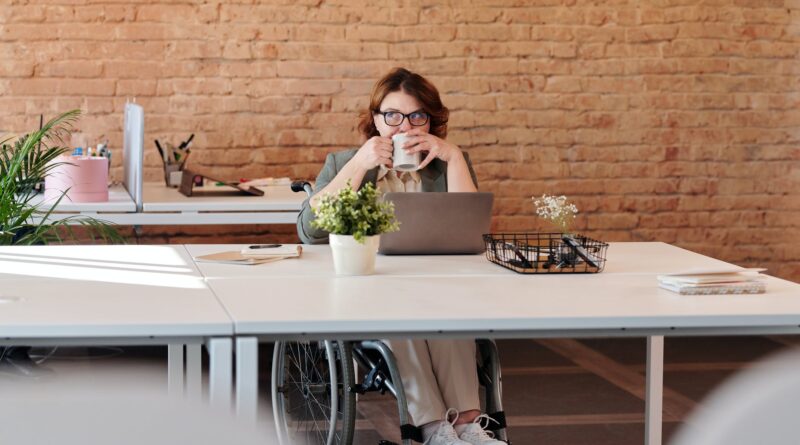 photo of woman drinking from mug