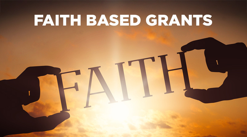 Two hands holding the word FAITH and the words Faith Based Grants floating against on oncoming light.