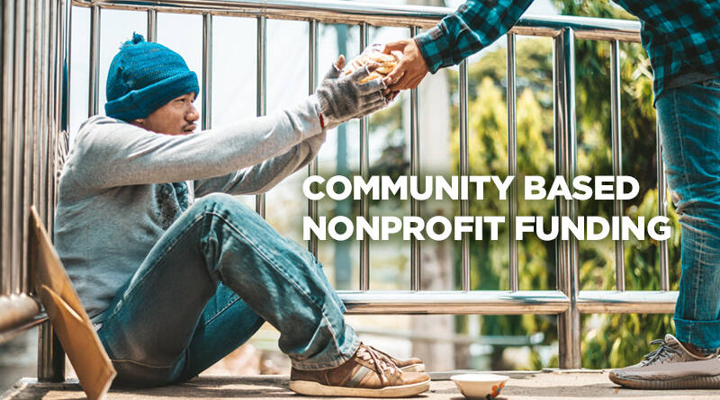 Community memeber helping a homeless individual through an act of kindness.