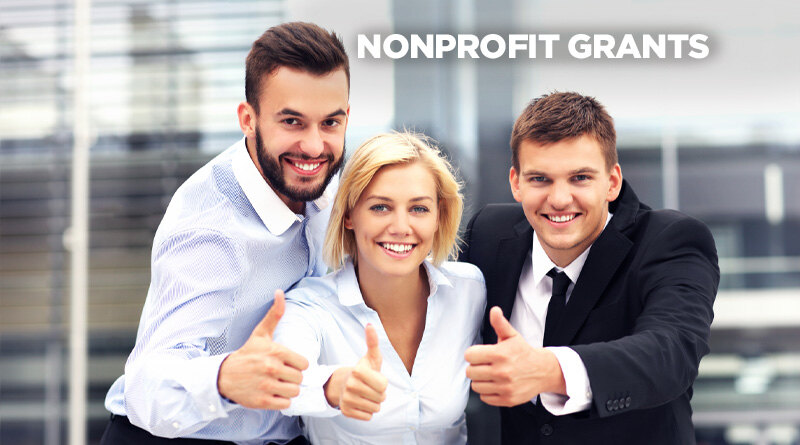 Nonprofit group giving the camera a thumbs up is solidarity with the caption: Nonprofit Grants.