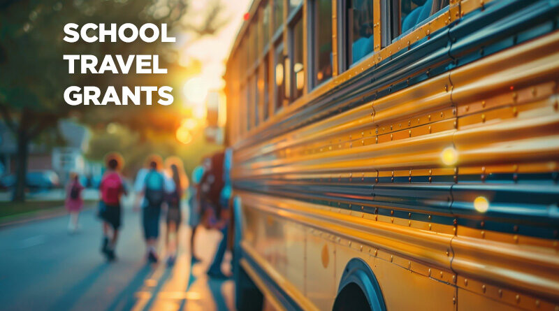 View of the side of a school bus with a caption: School Travel Grants- On the Road to Discovery and Wonder.