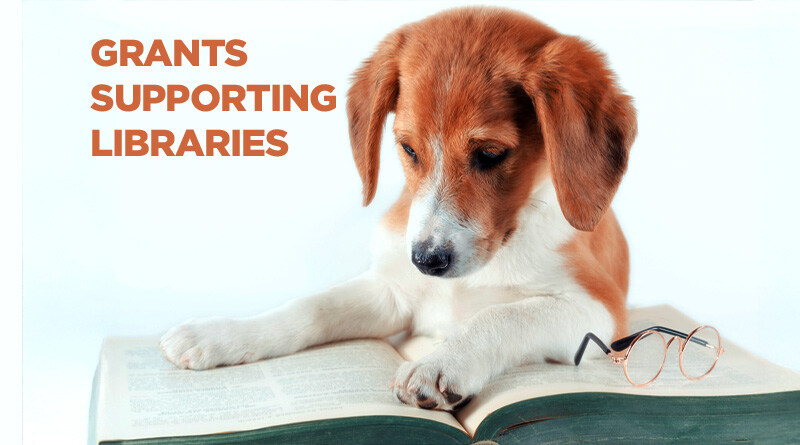 Puppy reading a book with the caption: Grants Supporting Libraries.