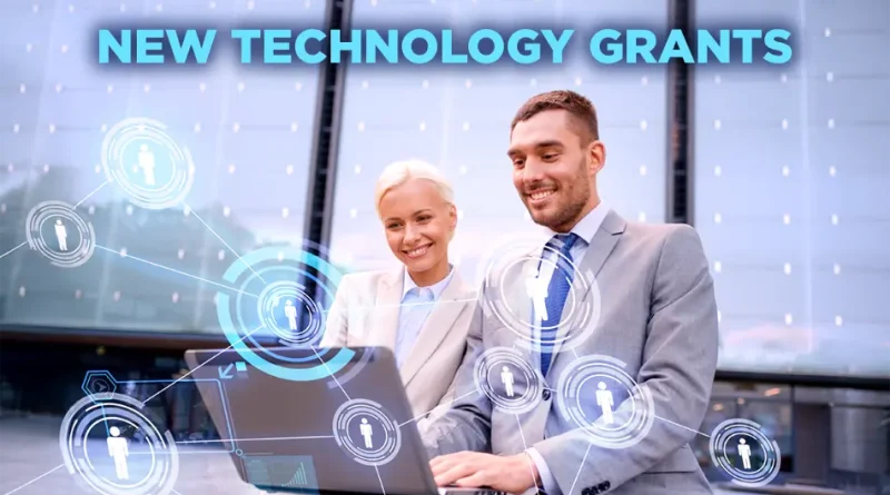 Two business professionals sitting outside and smiling while working on a laptop, with digital network graphics overlaying the image and the words 'New Technology Grants' displayed above them.
