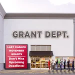 A line of people stands outside a large store-style building labeled “GRANT DEPT.” A red sign near the entrance reads “LAST CHANCE NOVEMBER GRANTS — Don’t Miss Upcoming Deadlines!” The image conveys urgency and demand for limited-time grant opportunities.
