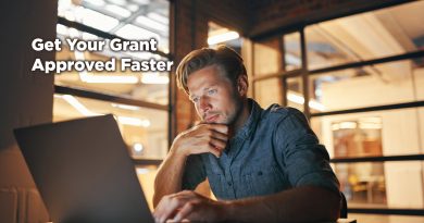 Man working late at a laptop in a warmly lit office, focused and thoughtful, with overlay text reading “Get Your Grant Approved Faster.”