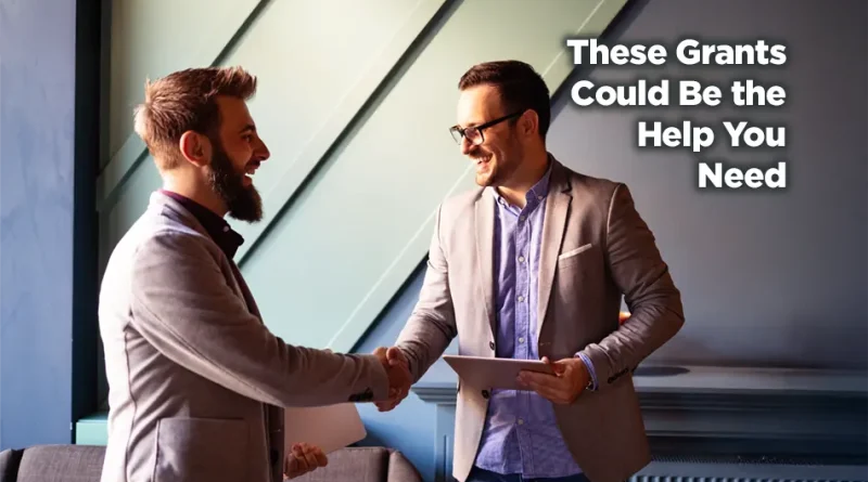 Two nonprofit leaders shaking hands and smiling. Clearly there is good news beings shared. The caption reads: These Grants Could Be the Help You Need.