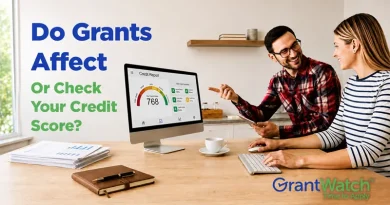 A promotional graphic shows two people discussing information on a desktop computer that displays a credit report with a score of 768. On the left side, large blue and green text asks, “Do Grants Affect Or Check Your Credit Score?” Papers, a notebook, and a coffee cup sit on the desk. The GrantWatch logo and the phrase “Time to Apply” appear in the lower-right corner.
