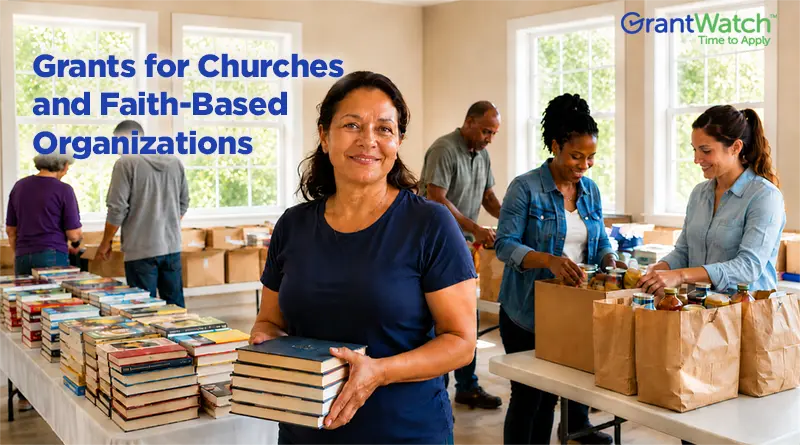 Volunteers and community members at a church-based outreach program sort books and pack grocery bags in a bright community room. A woman in the foreground holds a stack of books while others prepare donations. Text on the image reads: "Grants for Churches and Faith-Based Organizations" with the GrantWatch logo in the corner.