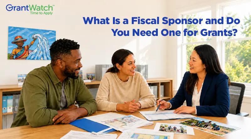 Three professionals meeting at a table to discuss grant funding and nonprofit project planning, illustrating fiscal sponsorship and grant eligibility for organizations seeking funding opportunities.