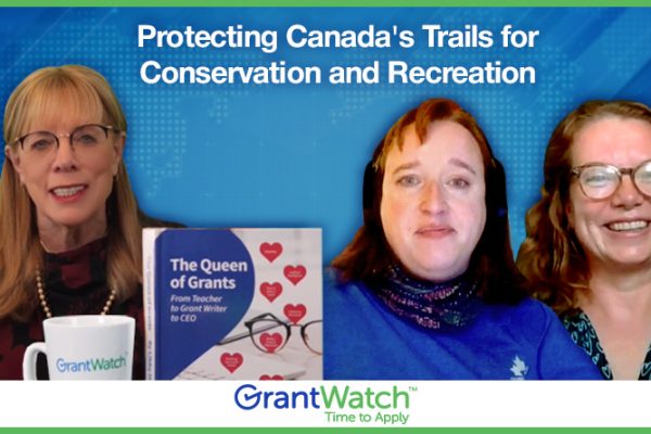GrantTalk Ep 51: Unlock Trail Funding: Trans Canada Trail Grants Revealed! Three women from GrantWatch discuss protecting Canada’s trails for conservation and recreation. A copy of the book “The Queen of Grants: From Teacher to Grant Writer to CEO” is visible on the table.
