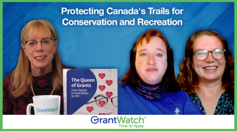 Three women from GrantWatch discuss protecting Canada’s trails for conservation and recreation. A copy of the book “The Queen of Grants: From Teacher to Grant Writer to CEO” is visible on the table.